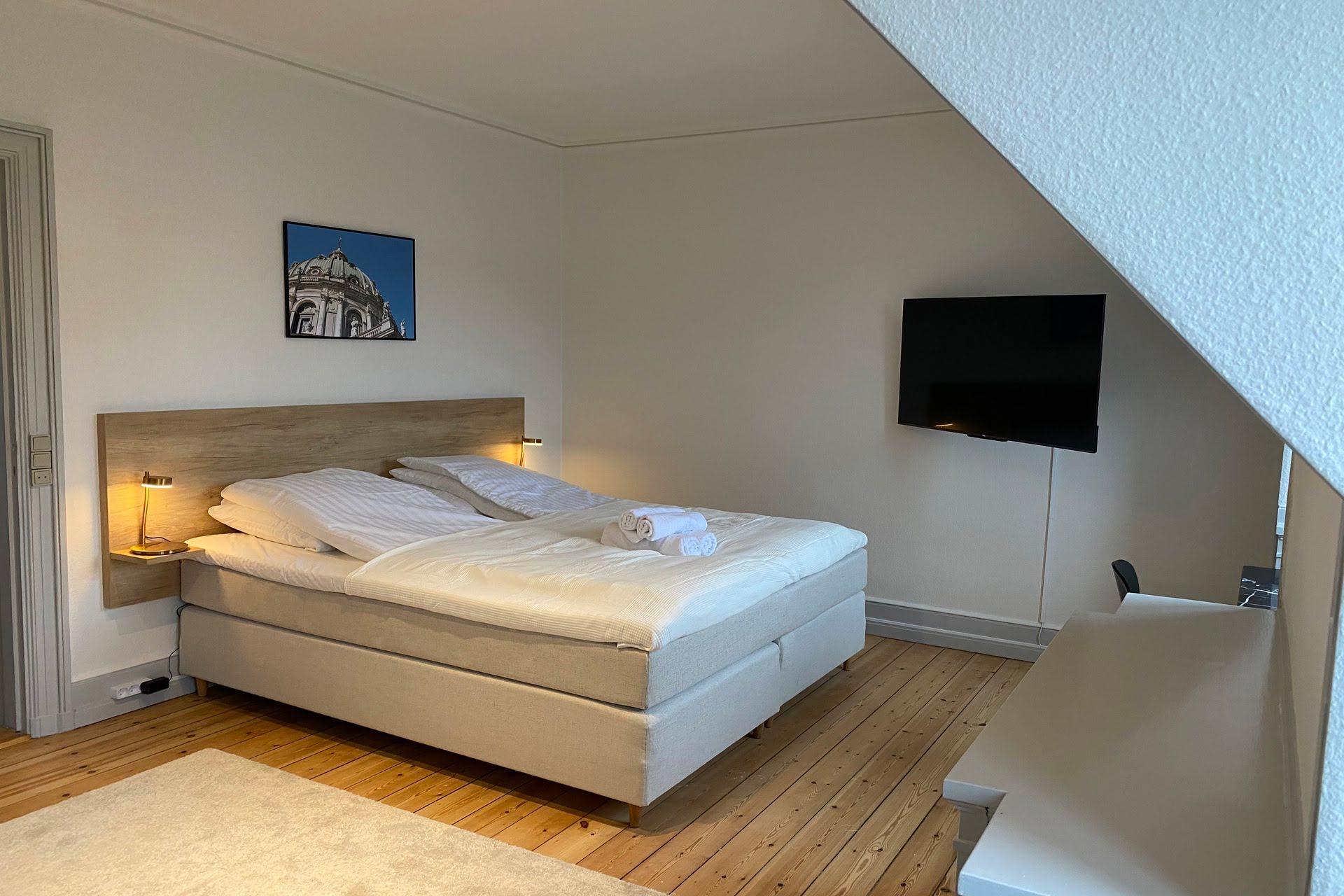 Simple bedroom of a Copenhagen Coliving apartment